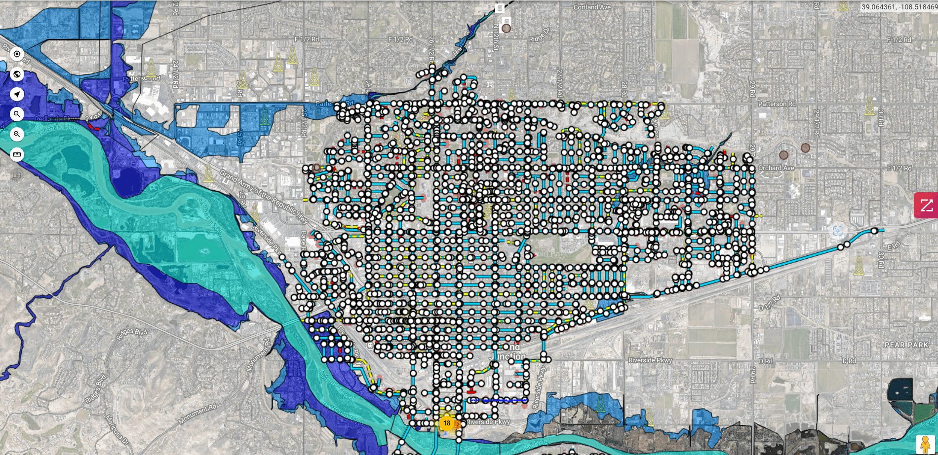 GIS map showing utility data layers, flood zones, and infrastructure details