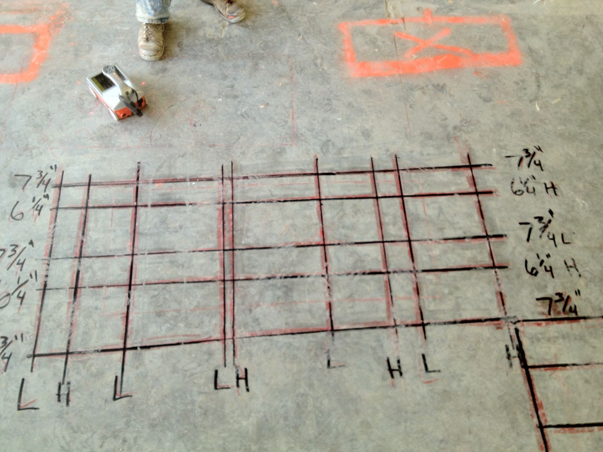 Technician using GPR equipment on a construction site to mark underground utilities missed by 811.