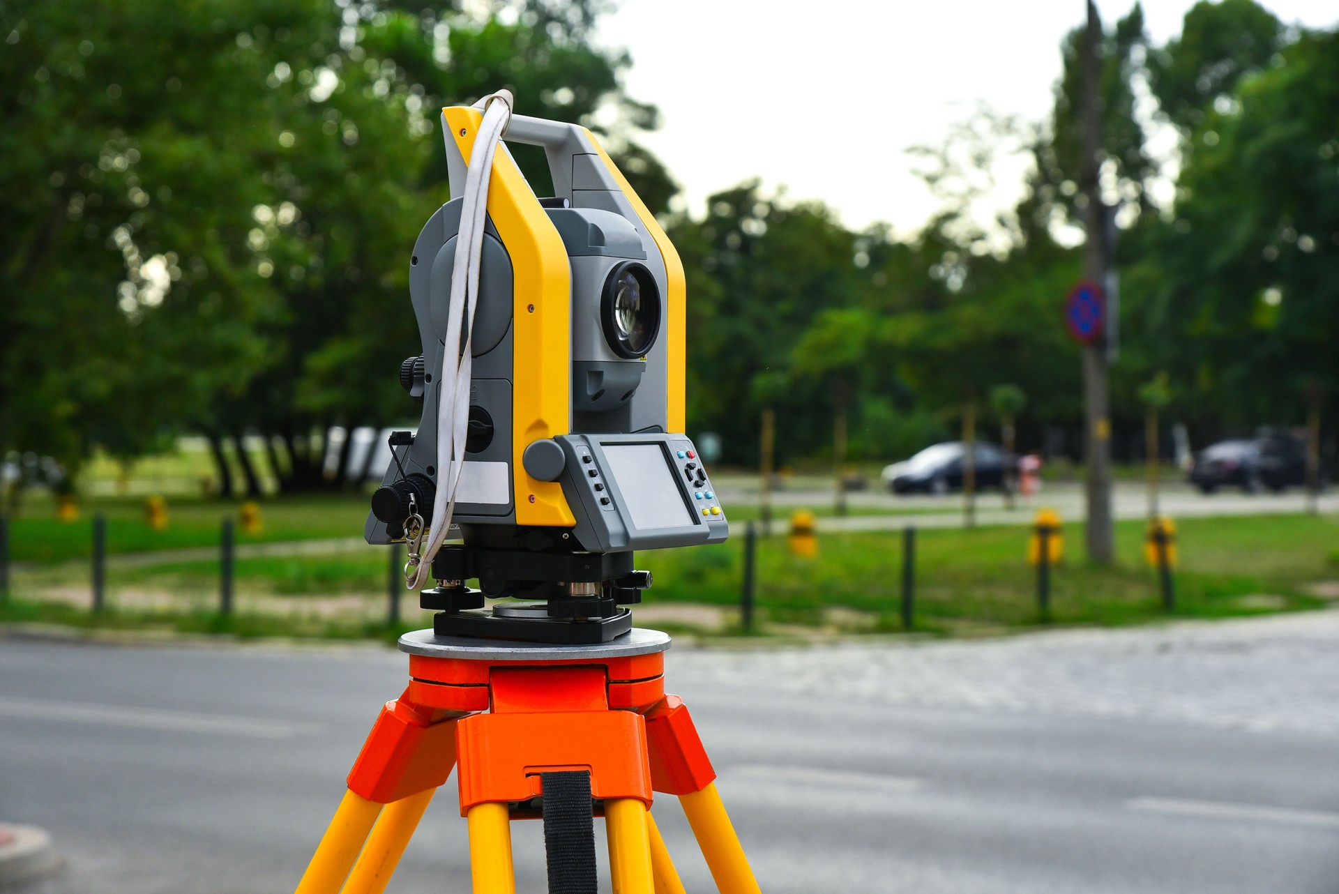 Geodetic electronic device theodelit on a tripod. Geodetic work on the ground, measuring the area of the territory, geodesy, level, construction.