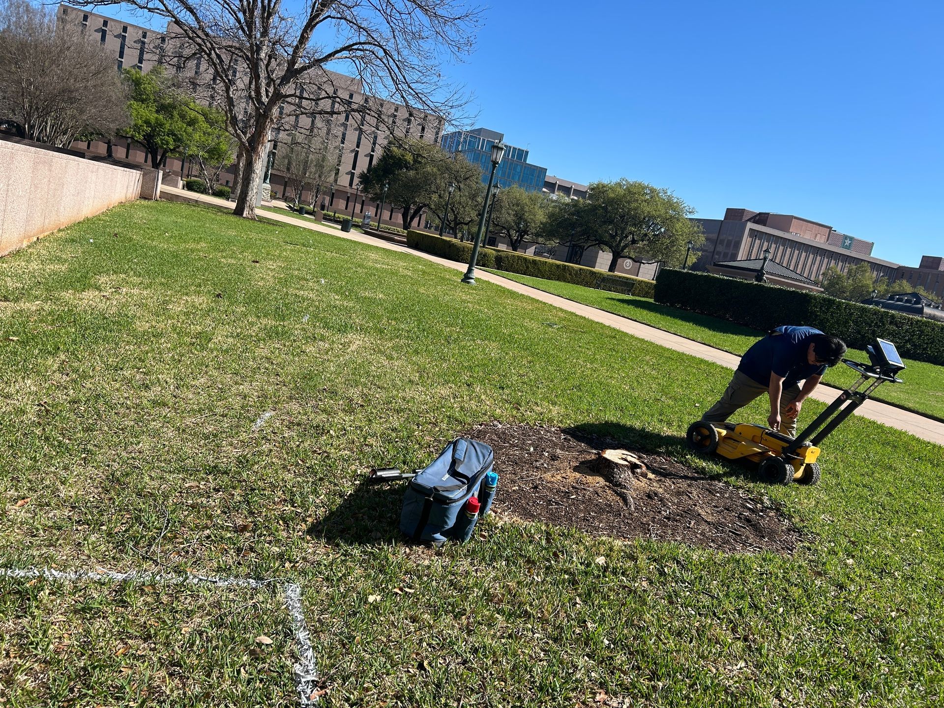 GPR technician reading radar scan reflections in the field to trace a non-metallic utility line